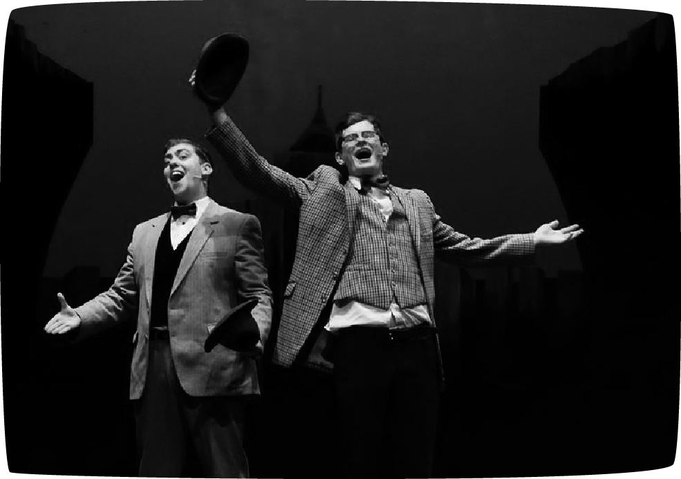 2 Men singing on stage